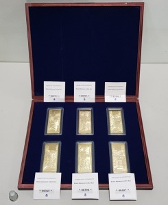WINDSOR MINT GOLDEN BAR SETS BRITISH BANKNOTES CONTAINED IN A DARK WOOD PRESENTATION CASE. EACH OF THE SIX BARS ARE FULLY LAYERED WITH 24-CARAT GOLD AND HAVE AN INDIVIDUAL CERTIFICATE OF AUTHENTICITY (No's 00365, 00393, 00397, 00398, 00407, 01436)