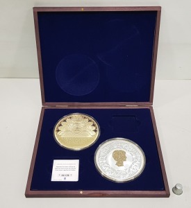SET OF 2 LARGE COMMEMORATIVE COPPER GOLD PLATED COINS SUPREME GOVERNOR OF THE CHURCH OF ENGLAND & DIANA PRINCESS OF WALES - A WIFE. CONTAINED WITHIN A ROSEWOOD COLOURED WOODEN PRESENTATION CASE