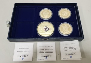 SET OF 4 VARIOUS COMMEMORATIVE COPPER COINS, GOLD PLATED. CONTAINED WITHIN A BLUE PRESENTATION BOX