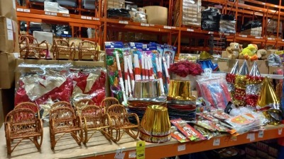 LARGE SELECTION OF PARTY PRODUCTS ON 3/4 SHELF IE. CONE & PORK PIE HATS, FEZES, STREAMERS, WATER BOMBS, PLUS WICKER ROCKERS, SKELETON PULL CORD CHATTERING TEETH, TREAT BAGS, FLAGS, COSTUMES ETC.