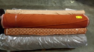 FULL PALLET CONTAINING 12 ROLLS OF ASSORTED FABRICS IN VARIOUS STYLES IE CHOCOLATE FLAT WEAVE, GOLD SILK EFFECT, RED VELOUR, FLORAL FLAT WEAVE, TERRACOTTA ETC (TOTAL 343M)