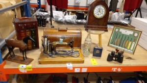 MISC GIFTWARE LOT ON HALF A SHELF IE. CARL ZEISS JENA BINOCULARS, MINI SINGER SEWING MACHINE, CARRIAGE CLOCK (GLASS CRACKED), BLACKBURN ROVERS HIP FLASK, HISTORY OF THE CRICKET BAT MONTAGE, THE OLD CURIOSITY SHOP WINE BOTTLE HOLDER, HORSE, GLASS BOTTLE
