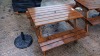 WOODEN BENCH WITH A PARASOL STAND