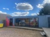 CONVERTED CONTAINER 1 - OFFICE - 40FT HIGH CUBE FULLY INSULATED AND LINED AC UNIT (HEAT AND COOLING) FULL ELECTRICS WITH CAT 6 POINTS LONG WITH SWITCH GEAR 6M FIXED WINDOWS AND 1 PEDESTRIAN DOOR PAINTED I GREY WITH PAINTED FLOOR 2 X FITTED STORAGE CUPB - 2