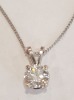 SINGLE STONE ROUND BRILLIANT DIAMOND PENDANT WITH WHITE GOLD CHAIN (STAMPED 14K) AND FOUR CLAW SETTINGS, ESTD WEIGHT OF DIAMOND 0.65 CT GAUGED TO BE COLOUR GRADE G/H, CLARITY GRADE VS1-2. VALUE FOR INSURANCE PURPOSES £2900 - 2