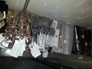 FULL SHELF OF APPROX 50 WATCHES AND COSMETIC JEWELERY IN VARIOUS STYLES IE VISAGE QUARTZ WATCH , EL S-SUPER WATCH , MNG WAIST BELT AND MNG BUCKLE BELT ETC