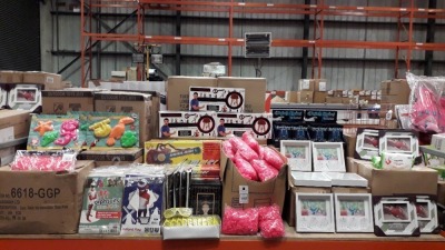 FULL BAY MIXED LOT CONTAINING METAL COPPER COLOURED BASKETS , PARTY SCANNERS , OUTDOOR TOYS MOULD SET , GEM TABLE DECORATIONS , PINK WIGS , PICTURE FRAMES ANTIBACTERIAL WIPES , JAMMER GUITARS , PARTY GLASSES ETC