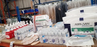 MISC LOT OF 100+ ITEMS OF PPE EQUIPMENT IE. INSTANT HAND SANITISER, FACE MARKS, HAND HYGIENE GEL, LIBRA SHEATHS ETC ON A SHELF PLUS 3 TRAYS FULL OF PE APRONS ESTD 5000+