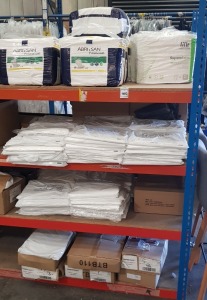 4 SHELVES OF PPE EQUIPMENT IE. ESTD 10,000+ PE APRONS, 240 X INCONTINENCE NAPPIES, FACE MASKS & SURGICAL GLOVES