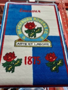 25 X BRAND NEW BLACKBURN ROVERS RUG - 100 % NYLON PILE - 100% POLYPROPOLENE BACKING - 120 CM LENGTH AND 80 CM WIDTH -COMES IN 5 BAGS OF 5