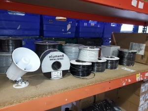 MISC LOT OF BRAND NEW AUDIO EQUIPMENT ON A SHELF IE. 24 X MONACOR HORN SPEAKERS NR-22KS PLIS 11 X VARIOUS ROLLS OF SPEAKER CABLE