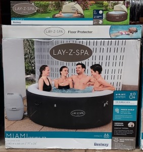 BRAND NEW BESTWAY MIAMI LAY-Z-SPA PORTABLE SPA 120 BUBBLE JET SYSTEM, FREEZE SHIELD & MULTI FUNCTIONAL PUMP-INFLATED SIZE 1.80 X 66 CM. ADDITIONAL ACCESSORIES : LAY-Z-SPA CANOPY & LAY-Z-SPA FLOOR PROTECTOR (NOTE: VAT NOT APPLICABLE ON THIS LOT)