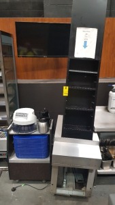 2 PIECE CATERING LOT CONTAINING 1 X FOOD TRAY STAND ON WHEELS WITH SAFESCAN (1250GBP) MEASURING MACHINE , A KETTLE AND MILK POURER AND A 4 TIER TEA BAG STAND COMES ON STAINLESS STEEL STAND - PLEASE NOTE ONLY ON 3 LEGS