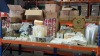 MISC LOT OF CONSUMABLE FOOD PACKAGING ON 1 1/2 HELVES IE, PIZZA BOXES, PAPER COFFEE CUPS, SCOTCHBAN STRING SATCHEL BAGS, PLASTIC DRINKS CUPS, METAL CHIP BASKETS (1 PORTION), WOODEN STIRRERS, CORRUGATED CUP HOLDERS, DOILIES ETC - 2