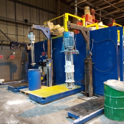 MIXING AREA 2 COMPRISING: TWO OFF PNEUMATIC VALVES & FILLING HEAD WITH RISE AND FALL STANDS. STEEL WATER STORAGE TANK (REF T670) WITH PUMPS AND CONTROLS.TWO OFF STAINLESS STEEL 5T MIXING VESSELS EACH WITH TWO MIXERS (REF M170 & M180) MOUNTED ON WEIGH CELL