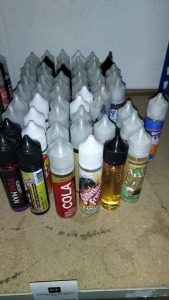 60 X VARIOUS E- CIGARETTES LIQUIDS ( ALL IN 50ML BOTTLES ) FLAVOURS TO INCLUDE AQUAVAPE COLA VANILLA , SOMETHING FRUITY BANANA BLACKBERRY , MILKSHAKER MINT CHOCOLATE , BAD BOY BELGIAN , MCBICCIES MALTED MILK , SUB ZERO RASPBERRY CREAM - ALL IN VARIOUS VG