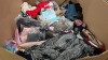 HALF PALLET OF ASSORTED CLOTHING CONTAINING FRUIT THE LOOM T- SHIRTS , SWEATSHIRTS , CARDIGANS , FACE MASKS , TRIP GRIP , LATEX GLOVES , PURSES ETC - ON A PALLET COME LOOSE