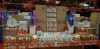 FULL BAY BRAND NEW MIXED LOT CONTAINING WOOLWORTHS WRAPPING PAPER, STANDS OF MOSART FOR BABIES, THE QUEENS DIAMOND JUBILEE PLATES AND MUGS, LARGE AMOUNT OF 3D MUSICAL CARDS WITH ENVELOPES, CERAMIC LIGHT UP STARS AND MERRY CHRISTMAS CARDS ETC