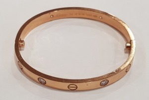 CARTIER ROSE GOLD LOVE BANGLE (STAMPED 750 & CARTIER) SET WITH FOUR ROUND BRILLIANT DIAMONDS - INSIDE MEASUREMENT 58 MM X 52 MM VALUATION FOR INSURANCE PURPOSES £10,200