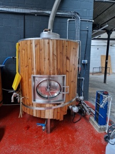 *** THIS ASSET IS LOCATED IN REDDISH & WILL NEED COLLECTING BY ARRANGEMENT UP TO FRIDAY 3RD FEBRUARY 2023 *** APPROX 2000 LITRE STAINLESS STEEL, HEATED BEER BREWING TANK WOODEN CLAD WITH LAYER OF INSULATION, STAINLESS STEEL PUMP AND 55 PLATE HEAT EXCHANGE