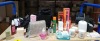 75+ BRAND NEW MIXED COSMETIC, BEAUTY & GIFT LOT ON 5 SHELVES IE. GHD HAIR STYLERS, UGG SHEEPSKIN & SUEDE CARE KIT, MARK HILL JUMBO / DROP CURLERS, TRIDUCNA NECK & SHOULDER MASSAGER, HANDBAGS, PURSES, BEURER BEAUTY STYLER PRO HOT AIR BRUSH, WAIST RELAX MAT - 2