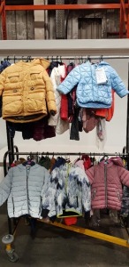 55 X BRAND NEW MIXED KIDS JACKETS / ONE PIECE BODY SUITS CLOTHING LOT TO INCLUDE TED BAKER FAUX FUR 3/4 LENGTH COAT IN PINK ( 3-5 YRS ) - BLUEZOO GIRLS WINTER COAT ( 5-6 YRS ) - COHENS & WILKS BABY BLUE COAT ( 12-18 MTHS ) - NINETEEN EIGHTY TWO BOYS JA