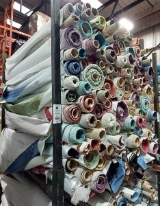 APPROX 150 PART ROLLS OF FABRICS IN ASSORTED COLOURS & DESIGNS (IN A FULL STILLAGE NOT INCLUDED)