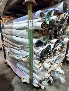 APPROX 150 PART ROLLS OF FABRICS IN ASSORTED COLOURS & DESIGNS (IN A FULL STILLAGE NOT INCLUDED)