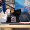 3 PIECE ELECTRONIC LOT CONTAINING 1 X IPHONE 7 ( CRACKED SCREEN) - WITH BOX AND CHARGE CABLE , 1 X APPLE I PAD WITH CASE , AND 1 GARMIN NUVI NAVIGATION WITH ANTI SLIP HOLDER