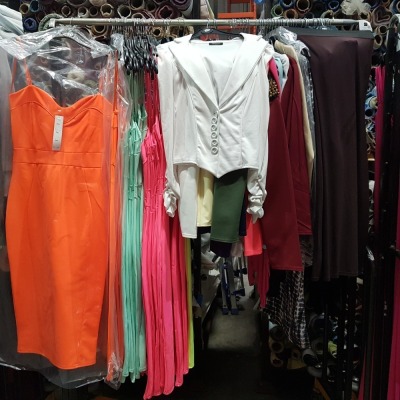 76 X BRAND NEW MIXED CLOTHING LOT TO INCLUDE MAXI DRESSES / FULL LENGTH SKIRTS / JACKETS / THROW OVERS - ALL IN VARIOUS STYLES AND COLOURS TO INCLUDE NEON ORANGE /NEON PINK / BLACK / PURPLE - ALL IN MIXED SIZES