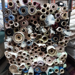 APPROX 150 PART ROLLS OF FABRICS IN ASSORTED COLOURS & DESIGNS (IN A FULL STILLAGE NOT INCLUDED)