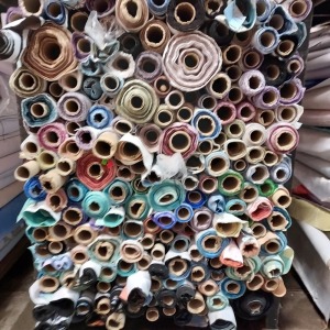 APPROX 150 PART ROLLS OF FABRICS IN ASSORTED COLOURS & DESIGNS (IN A FULL STILLAGE NOT INCLUDED)