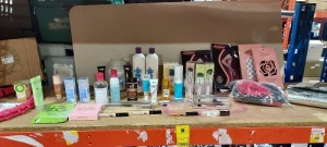 2 FULL SHELVES MIXED LOT CONTAINING VARIOUS MAKEUP / NOW TV SMART STICK / CONTROLLER CHARGING PORTS / FLIP FLOPS / CALVIN KLEIN BOXERS / SET OF 3 PENS / MOIST CONDITIONER / MASCARA HANDBAG ETC - ON 2 FULL SHELVES