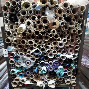 APPROX 150 X PART ROLLS & ENDS OF FABRIC IN VARIOUS COLOURS AND PATTERNS (IN A STILLAGE - NOT INCLUDED)