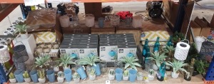 100+ BRAND NEW MIXED PREMIER GARDEN LOT CONTAINING GREY MOAI OIL BURNER / THE OUTDOOR LIVING OUTDOOR CUSHIONS / THE OUTDOOR LIVING LANTERNS / VARIOUS DECORATIVE ARTIFICIAL PLANTS / METAL HANGING DECORATIVE LIGHTS/ GLASS CUPS/ GLASS CANDLE HOLDERS/ ET