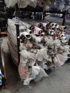 APPROX 150 X PART ROLLS & ENDS OF FABRIC IN VARIOUS COLOURS AND PATTERNS (IN A STILLAGE - NOT INCLUDED)