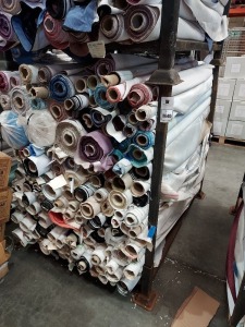 APPROX 150 X PART ROLLS & ENDS OF FABRIC IN VARIOUS COLOURS AND PATTERNS (IN A STILLAGE - NOT INCLUDED)