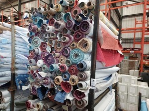 APPROX 150 X PART ROLLS & ENDS OF FABRIC IN VARIOUS COLOURS AND PATTERNS (IN A STILLAGE - NOT INCLUDED)