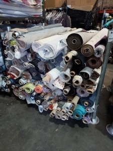 APPROX 120 X PART ROLLS & ENDS OF FABRIC IN VARIOUS COLOURS AND PATTERNS (IN A STILLAGE - NOT INCLUDED)