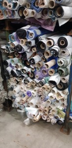 APPROX 150 X PART ROLLS & ENDS OF FABRIC IN VARIOUS COLOURS AND PATTERNS ( IN A STILLAGE - NOT INCLUDED )