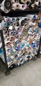 APPROX 150 X PART ROLLS & ENDS OF FABRIC IN VARIOUS COLOURS AND PATTERNS ( IN A STILLAGE - NOT INCLUDED )