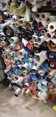 APPROX 150 X PART ROLLS & ENDS OF FABRIC IN VARIOUS COLOURS AND PATTERNS ( IN A STILLAGE - NOT INCLUDED )