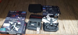 4X PIECE MIXED DRONE LOT CONTAINING - FX PRO ELITE HD PRO FOLDING DRONES - ULTIMATE PRO GPS FOLDING DRONE - STRIKER JET PRO FOLDING DRONES - PLEASE NOTE CUSTOMER RETURNS (WITH SPARE REMOTE)