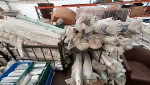 200 PIECE PART ROLLS OF FABRIC VARIOUS DESIGNS IN TWO CAGES (CAGES NOT INCLUDED)